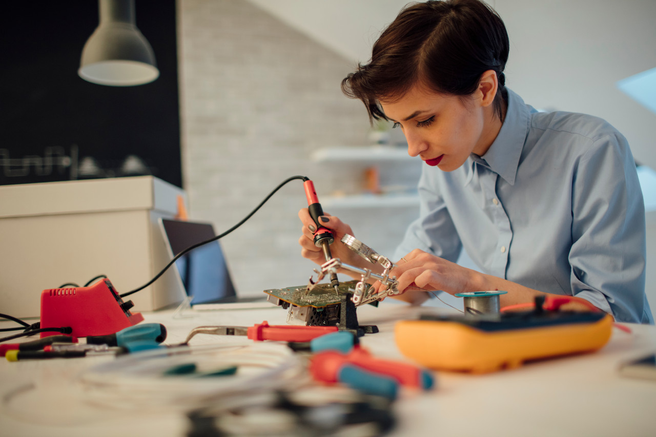 Student working in an electrical lab project.