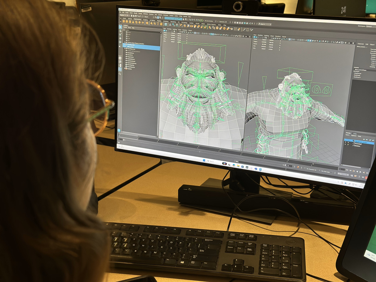 A visual effects student works at a computer.